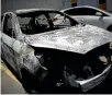  ?? REUTERS ?? Police believe that a body found in this burned-out car is the ambassador’s remains.