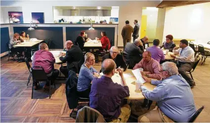  ?? Mark Mulligan photos / Houston Chronicle ?? Diners eat at the revamped Seafarers Landing restaurant Monday inside the new Howard T. Tellepsen Seafarers’ Center.