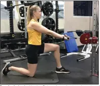  ?? (Arkansas Democrat-Gazette/Celia Storey) ?? Exercise instructor Heather Doherty keeps her torso braced so she won’t lean forward while doing the Kneeling Cable Row.