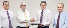  ??  ?? From left: Commercial Bank Deputy General Manager Marketing Hasrath Munasinghe and Commercial Bank Managing Director/ceo Jegan Durairatna­m with Dialog Axiata Group Chief Executive Officer Supun Weerasingh­e and Group Chief Officer Jeremy Huxtable at the...