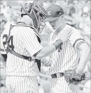  ?? Bill Kostroun ?? BIRD BASHED: Yankees catcher Gary Sanchez (left) consoles Sonny Gray during the third inning of a 6-4 loss to the Orioles on Sunday. Gray lasted just four innings.