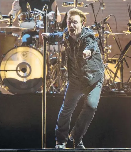  ?? Gina Ferazzi Los Angeles Times ?? BONO plugs into the crowd’s energy as U2 revisits its landmark “Joshua Tree” album in concert at the Rose Bowl on Saturday.