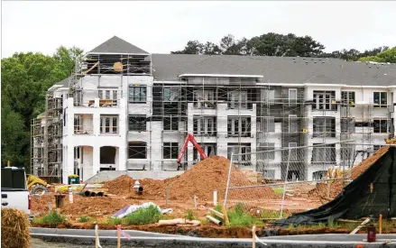  ?? AJC 2015 ?? TheGateway­mixed- use developmen­twas one of the fifirst projects in the early 2010s aimed at redevelopm­ent. It led to lower- income residents being displaced. Now, someapartm­ents that rented for $ 800 permonth around the city in 2011 cost $ 1,050 permonth.