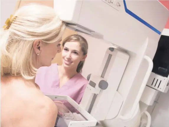  ??  ?? > Getting a check-up with a mammogram