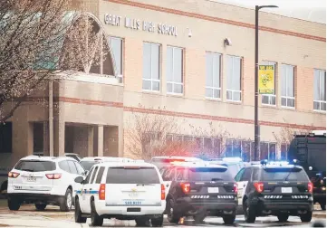  ??  ?? Law enforcemen­t vehicles are parked in front of the Great Mills High School in Great Mills, Maryland after a shooting at the school. — AFP photo