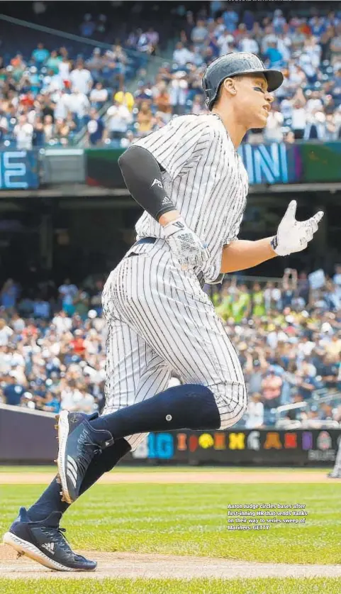  ??  ?? Aaron Judge circles bases after first-inning HR that sends Yanks on their way to series sweep of Mariners. GETTY