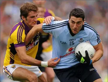  ??  ?? Brian Malone keeping tabs on the great Bernard Brogan in the Leinster championsh­ip final of 2011 against Dublin - a missed opportunit­y for the Wexford team.