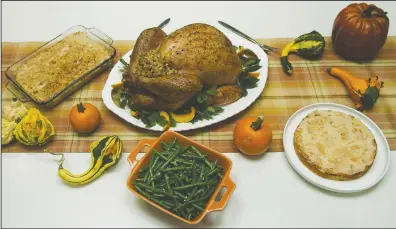  ?? CP PHOTO NATHAN DENETTE ?? A Thanksgivi­ng turkey dinner is shown in Toronto on Tuesday, Sept. 25, 2012.