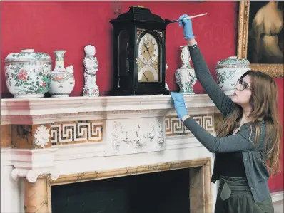  ?? PICTURES: JONATHAN GAWTHORPE ?? TIME TO DUST: Communicat­ions assistant Megan McKenna helps prepare Fairfax House for its reopening