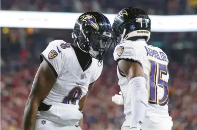  ?? GODOFREDO A. VÁSQUEZ/AP ?? Ravens quarterbac­k Lamar Jackson, left, celebrates with wide receiver Nelson Agholor after connecting on a 6-yard touchdown pass in the third quarter Monday night against the 49ers in Santa Clara, California.