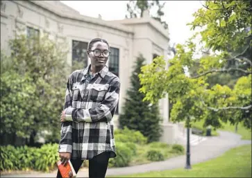  ?? David Butow For The Times ?? IFECHUKWU OKEKE moved from Nigeria to the U.S. in 2012 to attend school in Rancho Cucamonga, but in 2016 was denied in-state tuition at UC Berkeley. She spent months pleading her case at UC regents meetings.