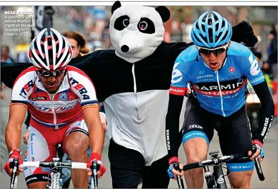  ?? ?? BEAR BACKED: A spectator gets behind Martin (right) on his way to victory in Liege in 2013