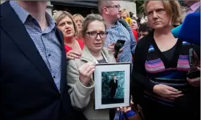  ??  ?? Catherine Power, sister of the late Thomas Power, at a protest at Leinster House last week.