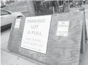  ?? MIKE MAYO/SOUTHFLORI­DA.COM ?? Loss of parking when the stalls were added means higher demand for fewer spaces. So the weekend-only market is charging for parking as of today.