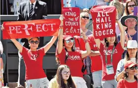  ??  ?? Hail the king: Centre Court fans (left) pay homage to Roger Federer as he defeats Dusan Lajovic in straight sets