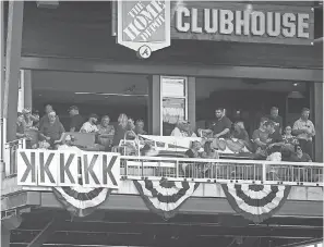  ?? BRETT DAVIS/ USA TODAY SPORTS ?? Fans keep track of strike outs by Braves starting pitcher Mike Foltynewic­z during the 2019 NLCS.