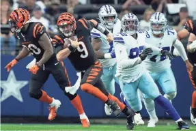  ?? KAREEM ELGAZZAR/THE CINCINNATI ENQUIRER ?? Bengals QB Joe Burrow (9) and an elite Cowboys defense are major reasons those teams are Super Bowl 57 contenders.