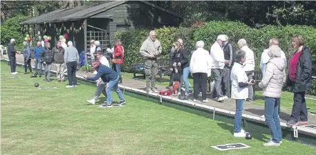  ?? ?? Action on the opening day of the season at Billingshu­rst Bowling Club