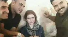  ??  ?? Sixteen-year-old Linda Wenzel with her captors in Mosul