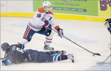  ?? RICHARD MARJAN / The Starphoeni­x ?? Spokane Chiefs’ Michale Aviani looks for a chance around the Saskatoon Blades’ Graeme Craig at Credit Union Centre
on Wednesday. The Blades fell to the Chiefs 4-1, and see their home-ice record fall to 3-7.