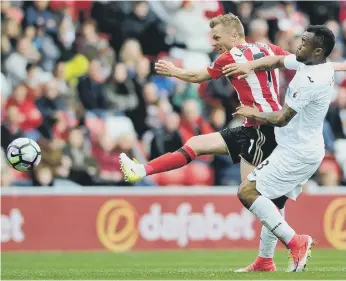  ??  ?? Sunderland midfielder Seb Larsson drives in a shot against Swansea, in what is likely to be his final home match.
