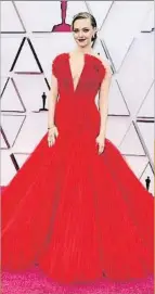  ??  ?? Amanda Seyfried. La actriz se mantiene como una de las mejores vestidas en esta gala con un diseño rojo de tul, firmado por Armani.