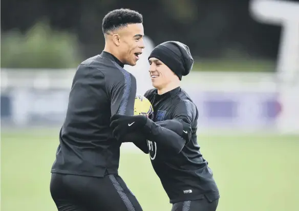  ??  ?? Phil Foden and Mason Greenwood.