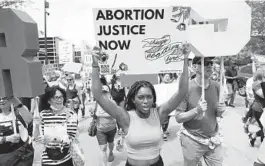  ?? CHRIS SWEDA/CHICAGO TRIBUNE ?? People march Saturday in downtown Chicago to protest against the possible U.S. Supreme Court reversal of the landmark Roe v. Wade decision.