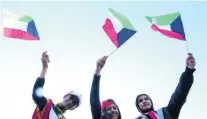  ?? Yasser Al Zayyat / AFP ?? Young women in Kuwait City join in celebratio­ns for the country’s National Day.