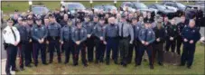  ?? TOM KELLY III — FOR DIGITAL FIRST MEDIA ?? Lower Pottsgrove Township Police Sgt. Robert R. Greenwood (center with his son, Ross a PSP Trooper) stand with officers there to wish him luck on his retirement. Greenwood served as a police officer for 34 years.