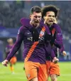  ?? PHOTO: GETTY IMAGES ?? Aymeric Laporte (left) celebrates scoring Manchester City’s first goal with teammate Leroy Sane during their team’s Champions League group F match against Olympique Lyonnais at Groupama Stadium in Lyon, France, yesterday. The match was a 22 draw, allowing City to advance to the last 16.