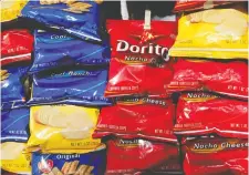  ?? MARK LENNIHAN/THE ASSOCIATED PRESS FILES ?? Cool Ranch Doritos are out of production, one of dozens, of products temporaril­y halted in March as manufactur­ers struggled to keep pace with the demand for snacks.