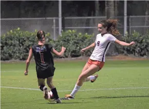  ?? ALEXANDER PETERMAN ?? Oxbridge Academy's Brynn Weiser contends for possession with King's Academy's Tori Estrada during a district semifinal on Monday.