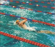  ?? NATHAN BURTON/Taos News ?? Taos High School senior Estevan Andres Salazar competes in a swim competitio­n.
