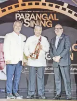  ?? ?? Dr. Nicanor Tiongson is one of the recipients of the Lifetime Achievemen­t Award. He is joined by FDCP chair and Cinemalaya festival director Chris Millado.