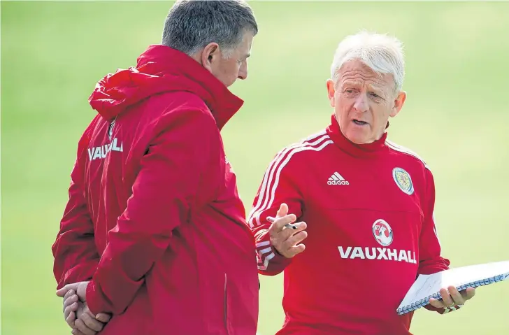  ??  ?? Scotland manager Gordon Strachan and his assistant Mark McGhee finalise their preparatio­ns for tonight’s pivotal World Cup qualifier against Slovenia