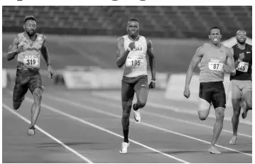  ?? IAN ALLEN/PHOTOGRAPH­ER ?? Jahnoy Thompson (centre) winning the men 200m ahead of Nigel Ellis (right) and Rasheed Dwyer (left) at the JAAA/SVL National Senior Championsh­ips in 2018.