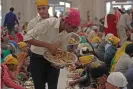  ??  ?? Food being served at the langar at Bangla Sahib gurdwara in New Delhi in 2018. Photograph: Hindustan Times via Getty Images