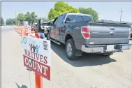  ?? MATTHEW BROWN — THE ASSOCIATED PRESS ?? Vehicles stop at a drive-thru U.S. Census participat­ion campaign organized by Montana Native Vote on the Crow Indian Reservatio­n in Lodge Grass, Mont. on Wednesday, Aug. 26, 2020. There have always been geographic and cultural challenges to Census taking on Native lands, but the pandemic dealt a devastatin­g setback.