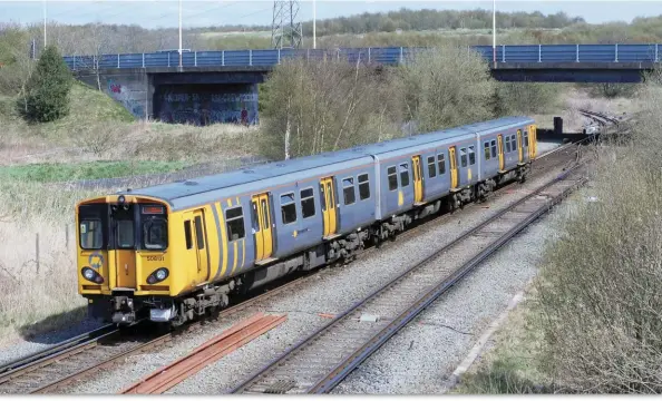  ??  ?? No. 508131 is leaving Bidston station with a West Kirby to Liverpool train on 1st May 2013 and is about to cross Bidston West Junction, which had by this time been single tracked and was used as a turn back siding.