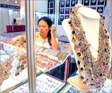  ?? HENG CHIVOAN ?? Locally-made finery on display at the Cambodia Internatio­nal Gems and Jewelry Fair, held at the Koh Pich Convention and Exhibition Centre in Phnom Penh in the past.