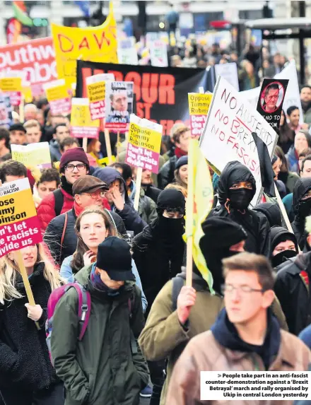  ??  ?? &gt; People take part in an anti-fascist counter-demonstrat­ion against a ‘Brexit Betrayal’ march and rally organised by Ukip in central London yesterday