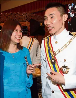  ??  ?? All smiles: Lee and Goh sharing a light moment after receiving their awards at Seri Negeri, Malacca.