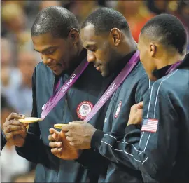  ?? JOHN LEYBA — DENVER POST ?? Kevin Durant and LeBron James, with Russell Westbrook, right, got to enjoy a taste of victory together as members of the U.S. national team at the London Olympics in 2012.