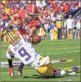  ?? / AP Matthew Hinton ?? UGA’s Rodrigo Blankenshi­p gets tackled by LSU’s Grant Delpit on a fake field goal attempt in the first half. Blankenshi­p fumbled and the Tigers recovered, for one of their four takeaways.