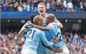  ?? AFP ?? Manchester City's Brazilian striker Gabriel Jesus (L) celebrates with teammates after scoring their third goal