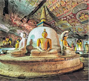  ??  ?? CAVE ART
The golden Buddhas of Dambulla were among the highlights of a trip to Sri Lanka
