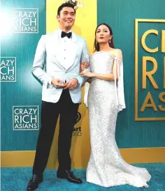  ?? — Reuters photo ?? ‘Crazy Rich Asians’ actors Henry Golding and Constance Wu during the premiere of the movie in Los Angeles.