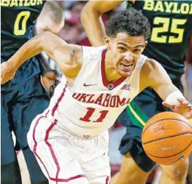  ?? THE ASSOCIATED PRESS ?? The Atlanta Hawks ended up getting former University of Oklahoma point guard Trae Young in the NBA draft Thursday night after picking Luka Doncic at No. 3 overall but trading his rights to the Dallas Mavericks for Young and a pick in the 2019 draft.