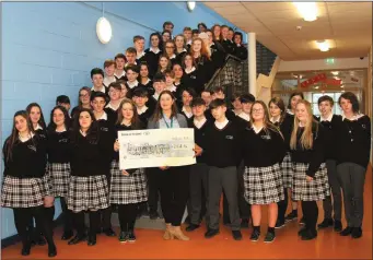  ??  ?? Creagh College students raise €2,513 for the Irish Wheelchair Associatio­n. Student Sinead Barnes presents the cheque to Mary O’Connor, IWA programme assistant.